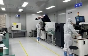 Keda's R & D team in white suits working on drone jammer modules in the lab