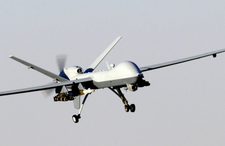 Military combat drone (MQ - 9 - like) flying for aerial strike missions